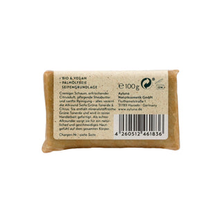 A 100g bar of Naturkosmetik GmbH Alpine Sourdough Bread Butter (Grüne Tonerde) wrapped in natural brown kraft paper, showing a beige paper label with text and a barcode.