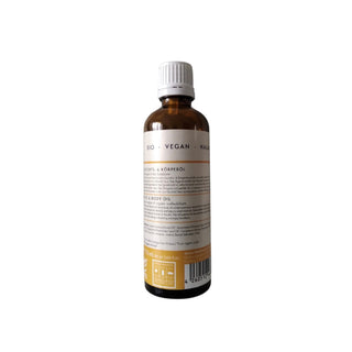 An amber glass bottle of vegan saffron oil with a white cap, shown from the back against a plain white background.