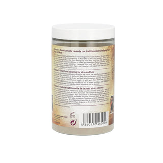 A jar of traditional hair cleansing shampoo with a white cap and a beige label showing product details in German and English, photographed against a plain white background.