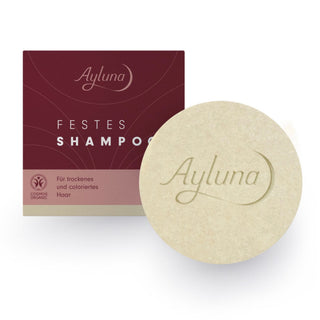 Ayluna Festes Shampoo bar shown next to its dark burgundy and pink packaging box on a clean white background.