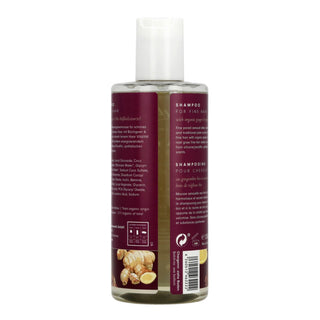 A bottle of shampoo for fine hair with ginger root extract, shown from the back. The bottle is clear plastic with a white flip-top cap, revealing a light olive-green liquid inside.