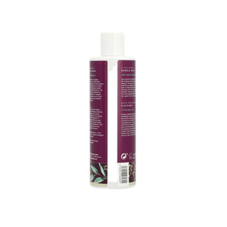 A bottle of herbal hair growth liquid shown from the back, featuring a deep purple label with white text and a white cap, set against a plain white background.