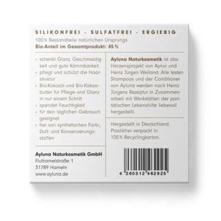 Beige blanket with a brown label on a white background